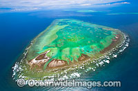 Aerial view of One Tree Island and reef, with Wistari Reef, Heron Island Reef and Sykes Reef visible in background. One Tree Island is a small coral cay located near the Tropic of Capricorn, Sth Great Barrier Reef, Australia, part of the Capricorn Group.