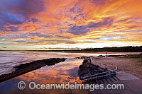 Sawtell Rock Pool at dusk with a blazing sunset. Sawtell, New South Wales, Australia